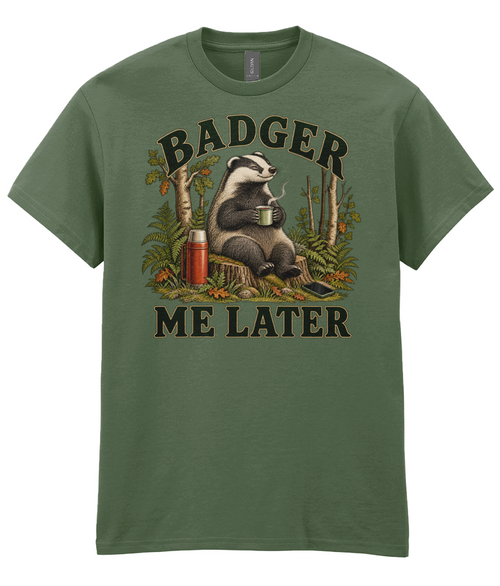 Front view of the Uphill Society Badger Me Later T-Shirt, featuring badger sitting in woodland with a mug and flask.